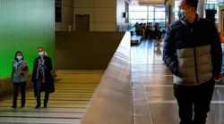 LOS ANGELES, CA - MARCH 18: People walk up the ramp, exiting the secure area at the Tom Bradley International Terminal at LAX on Wednesday, March 18, 2020 in Los Angeles, CA.