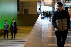 LOS ANGELES, CA - MARCH 18: People walk up the ramp, exiting the secure area at the Tom Bradley International Terminal at LAX on Wednesday, March 18, 2020 in Los Angeles, CA. LOS ANGELES, CA - MARCH 18: People walk up the ramp, exiting the secure area at the Tom Bradley International Terminal at LAX on Wednesday, March 18, 2020 in Los Angeles, CA.