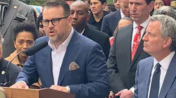 Evan Bernstein (L) speaking at NYC Mayor Bill Deblasio's press conference the day after Pittsburgh Tree of Life shootings