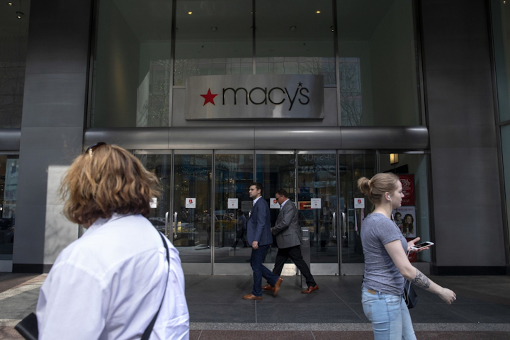 People pass Macy's along North Michigan Avenue near Water Tower Place on May 8, 2018, in Chicago.