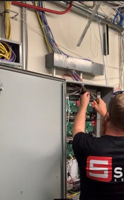Stone Security Project Manager Tjay Mitchell wires a Mercury Security access control panel. Stone Security Project Manager Tjay Mitchell wires a Mercury Security access control panel.