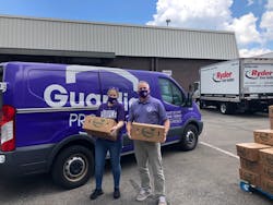 Guardian Protection volunteers Caroline Erny and Kevin Bish load the Guardian van with fresh food for the hungry. Guardian Protection volunteers Caroline Erny and Kevin Bish load the Guardian van with fresh food for the hungry.