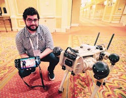 Nick Badyal, software engineer for Ghost Robotics, shows off the company's Vision 60 quad-legged autonomous unmanned ground vehicle (Q-UGV) at ISC West 2021. Nick Badyal, software engineer for Ghost Robotics, shows off the company's Vision 60 quad-legged autonomous unmanned ground vehicle (Q-UGV) at ISC West 2021.