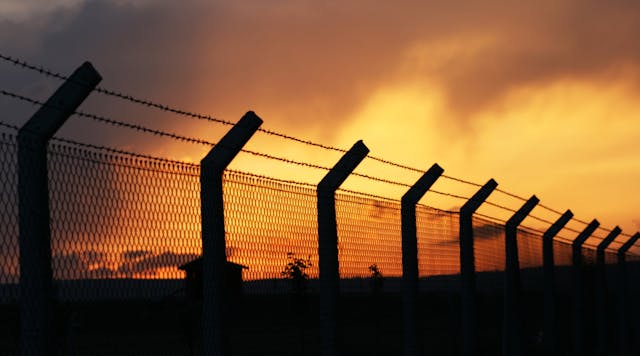 Perimeter fence at sunset