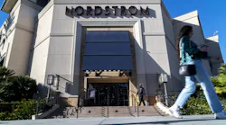 A security guard patrols the front entrance of a Los Angeles Nordstrom after an organized group of thieves attempted a smash-and-grab robbery last week.