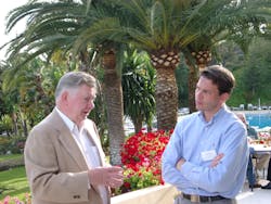 Joe Freeman (left) and Fredrik Nilsson, Vice President of the Americas at Axis Communications discuss technology issues in 2006 at a security conference in France. Joe Freeman (left) and Fredrik Nilsson, Vice President of the Americas at Axis Communications discuss technology issues in 2006 at a security conference in France.