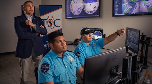 Safety and Security Executive Director Jaime Salazar of Texas Southmost College supervises staff in the command center.