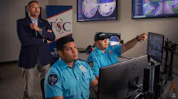 Safety and Security Executive Director Jaime Salazar of Texas Southmost College supervises staff in the command center.
