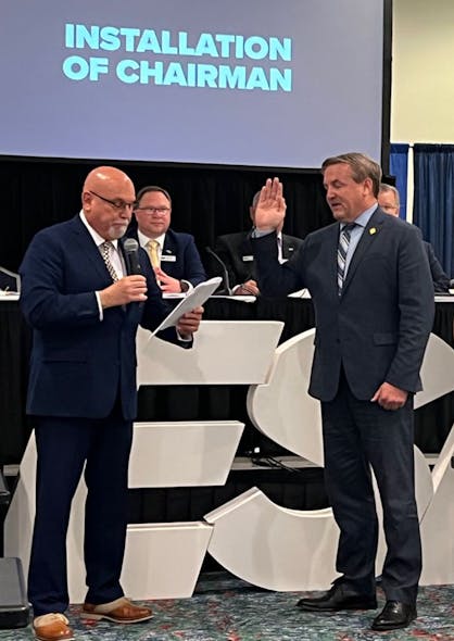 New ESA President John Loud (right) is installed as Chairman of the Association by Kirk MacDowell as outgoing ESA President Jamie Vos looks on.