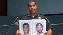 At a news conference Bloomington Police Chief Booker Hodges held up photos of Shamar Alon Lark, left, and Rashad Jamal May, sought in connection with gunfire inside the Mall of America last week on Aug. 8, 2022, in Bloomington, Minnesota.