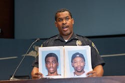 At a news conference Bloomington Police Chief Booker Hodges held up photos of Shamar Alon Lark, left, and Rashad Jamal May, sought in connection with gunfire inside the Mall of America last week on Aug. 8, 2022, in Bloomington, Minnesota. At a news conference Bloomington Police Chief Booker Hodges held up photos of Shamar Alon Lark, left, and Rashad Jamal May, sought in connection with gunfire inside the Mall of America last week on Aug. 8, 2022, in Bloomington, Minnesota.