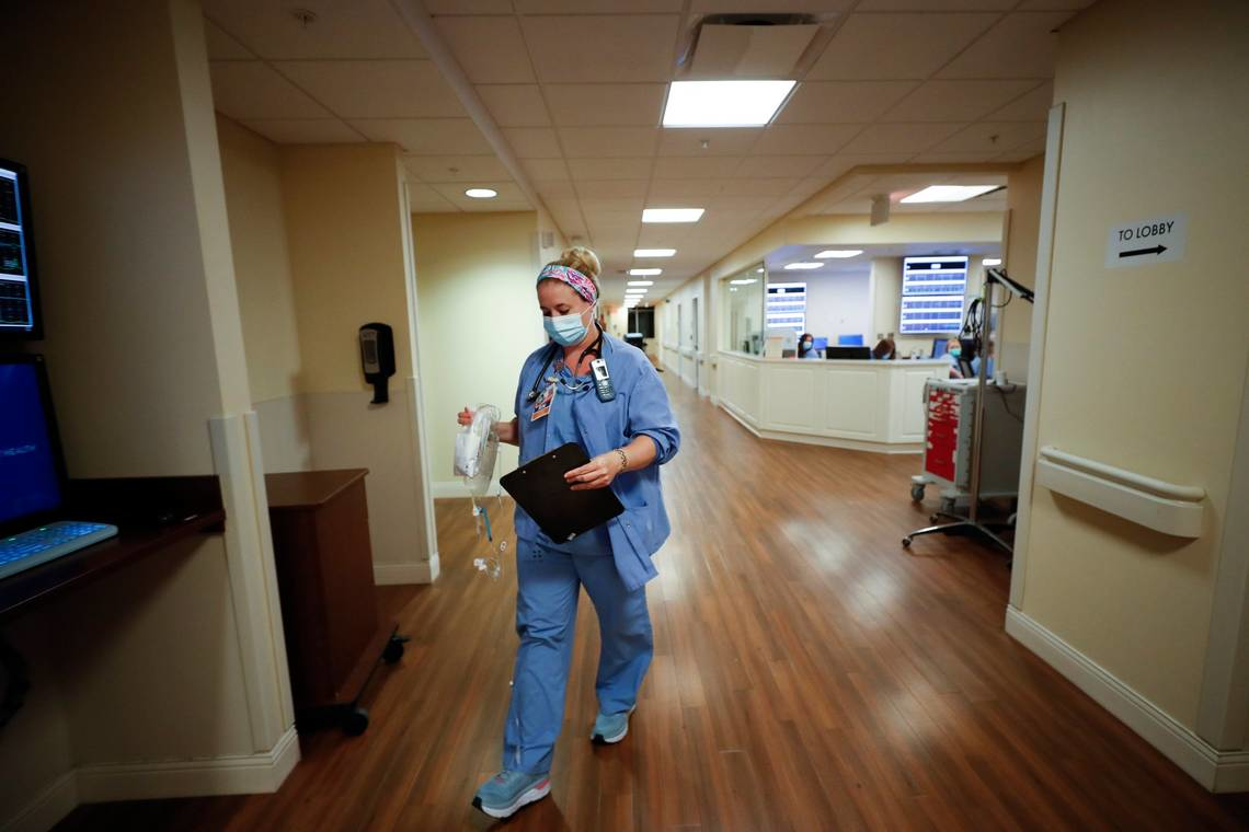 Cydney Kanis, of Lexington, Ky., a charge nurse at Baptist Health hospital works to admit a new mother in the maternity unit at Baptist Health in Lexington, Ky.,