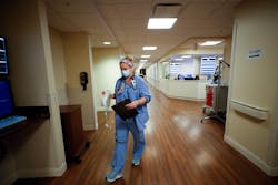 Cydney Kanis, of Lexington, Ky., a charge nurse at Baptist Health hospital works to admit a new mother in the maternity unit at Baptist Health in Lexington, Ky., Cydney Kanis, of Lexington, Ky., a charge nurse at Baptist Health hospital works to admit a new mother in the maternity unit at Baptist Health in Lexington, Ky.,