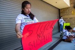 At a protest outside LAUSD headquarters in June, a student holds a sign she made with a friend as she and other students called for an end to police officers on campuses. At a protest outside LAUSD headquarters in June, a student holds a sign she made with a friend as she and other students called for an end to police officers on campuses.