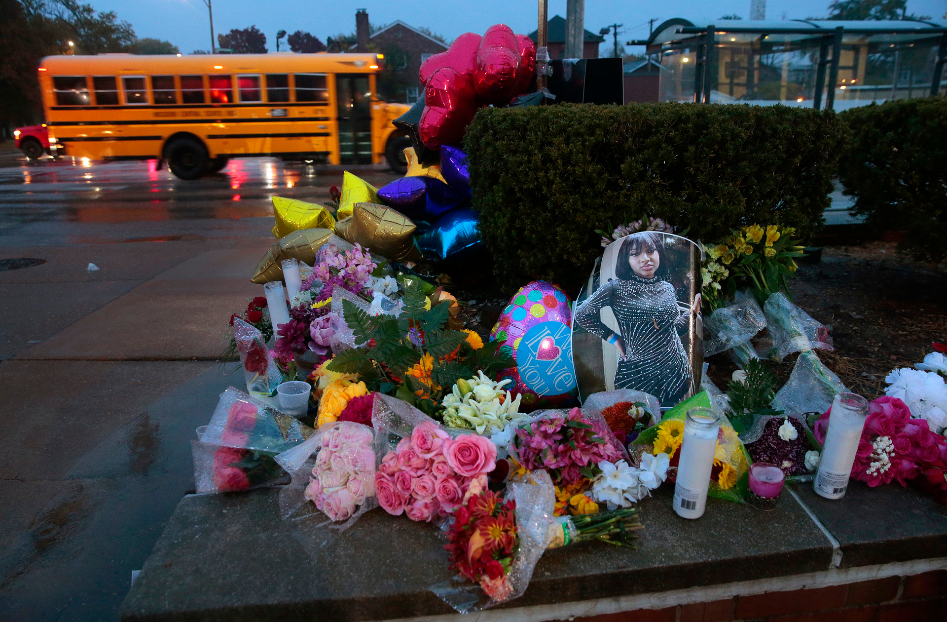 A photo of Alexzandria Bell, 15, rests at the scene of a growing floral memorial to the victims of Monday's school shooting at Central Visual & Performing Arts High School, on Tuesday, Oct. 25, 2022. Bell and teacher Jean Kuczka were killed, along with gunman Orlando Harris, in Monday's shooting.