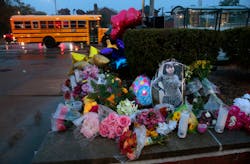 A photo of Alexzandria Bell, 15, rests at the scene of a growing floral memorial to the victims of Monday's school shooting at Central Visual & Performing Arts High School, on Tuesday, Oct. 25, 2022. Bell and teacher Jean Kuczka were killed, along with gunman Orlando Harris, in Monday's shooting. A photo of Alexzandria Bell, 15, rests at the scene of a growing floral memorial to the victims of Monday's school shooting at Central Visual & Performing Arts High School, on Tuesday, Oct. 25, 2022. Bell and teacher Jean Kuczka were killed, along with gunman Orlando Harris, in Monday's shooting.