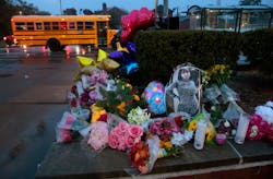 A photo of Alexzandria Bell, 15, rests at the scene of a growing floral memorial to the victims of Monday's school shooting at Central Visual & Performing Arts High School, on Tuesday, Oct. 25, 2022. Bell and teacher Jean Kuczka were killed, along with gunman Orlando Harris, in Monday's shooting. A photo of Alexzandria Bell, 15, rests at the scene of a growing floral memorial to the victims of Monday's school shooting at Central Visual & Performing Arts High School, on Tuesday, Oct. 25, 2022. Bell and teacher Jean Kuczka were killed, along with gunman Orlando Harris, in Monday's shooting.