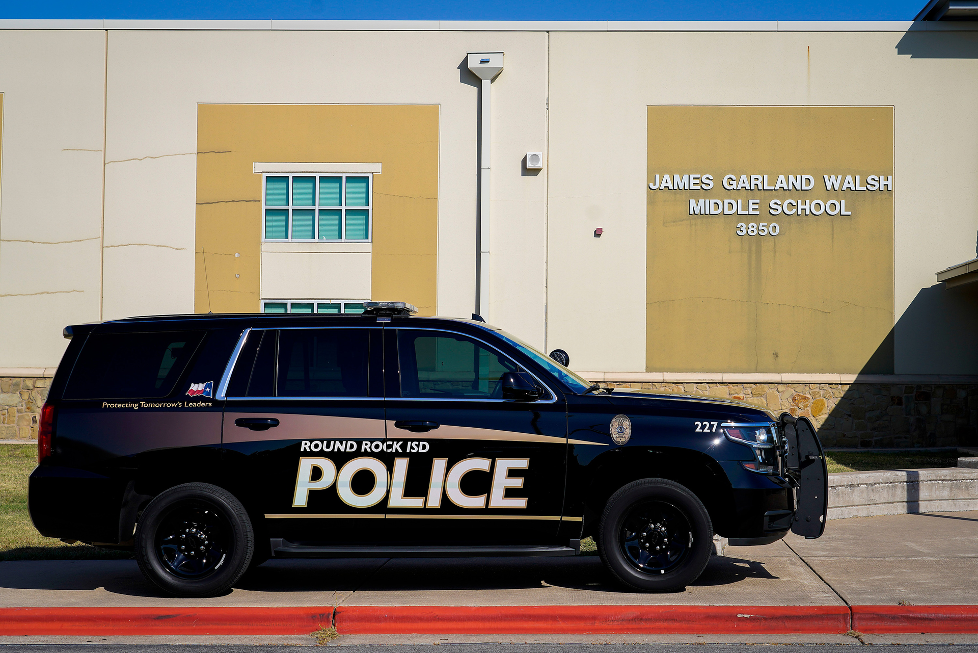 A Round Rock ISD vehicle is seen outside during a school safety active shooter training demonstration conducted by the Texas Commission on Law Enforcement at Walsh Middle School on July 11, 2022, in Round Rock, Texas.