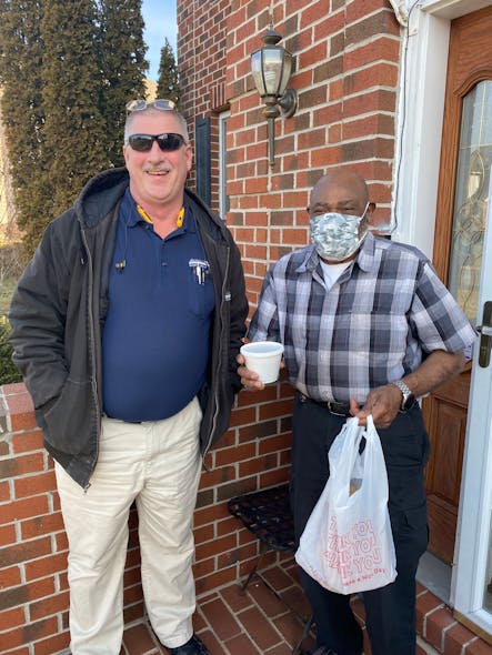 An Advantech employee personally delivers to a Meals on Wheels recipient.