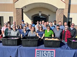 Cook & Boardman assembled 500 USA care packages for armed service members. Cook & Boardman assembled 500 USA care packages for armed service members.