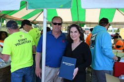 Holmes Security Operations Director Duncan Hubbard was honored by Kathy Jensen, Mayor pro tem for the City of Fayetteville, during its Crimestoppers BBQ fundraiser. Holmes Security Operations Director Duncan Hubbard was honored by Kathy Jensen, Mayor pro tem for the City of Fayetteville, during its Crimestoppers BBQ fundraiser.