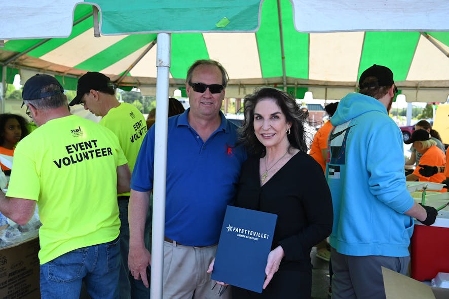 Holmes Security Operations Director Duncan Hubbard was honored by Kathy Jensen, Mayor pro tem for the City of Fayetteville, during its Crimestoppers BBQ fundraiser.