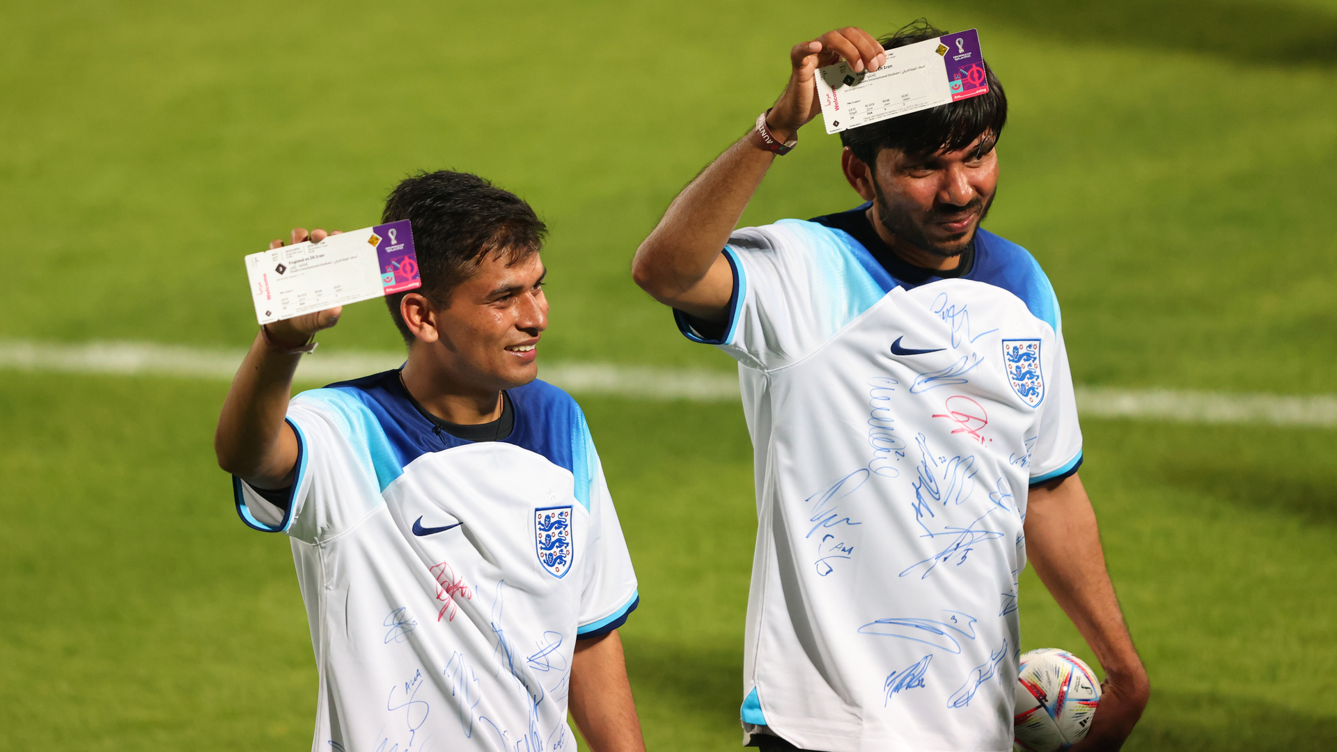 Two Men Pose With England Vs Iran Match Tickets Produced By Hid During A Community Event At Al Wakrah Stadium On Nov 17 2022 In Doha Qatar Photo By Marc Atkins 6397977d289d7