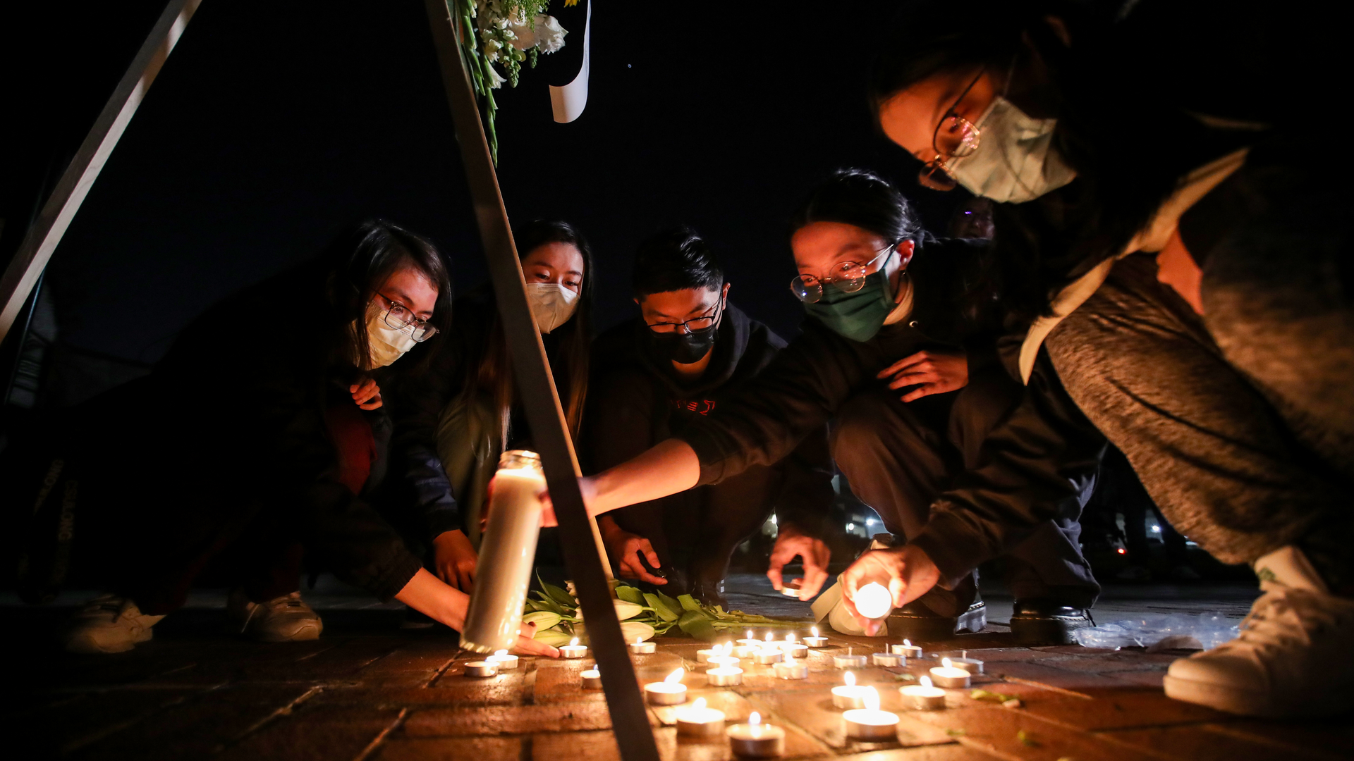 Mourners take part in a vigil for the victims of a mass shooting at the Star Dance Studio on Monday, Jan. 23, 2023, in Monterey Park, Calif.