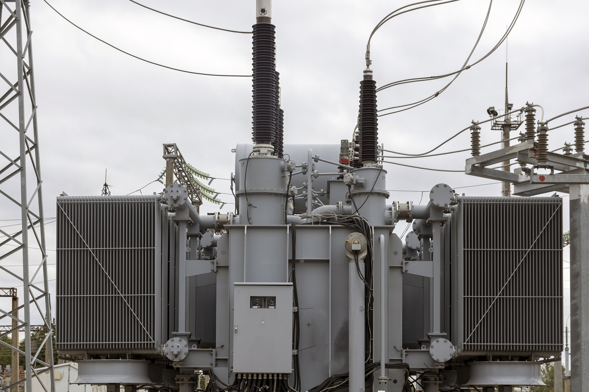 Example of a modern transformer substation with many connected high-voltage wires and cables, electrical equipment maintains a stable energy voltage.