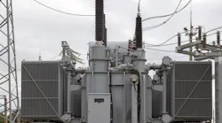 Example of a modern transformer substation with many connected high-voltage wires and cables, electrical equipment maintains a stable energy voltage.