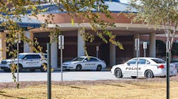 Views of multiple police cars parked at Norcross High School on Thursday, October 27, 2022. The school has increased police presence after a student was fatally shot near the campus.