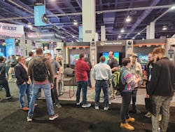 A crowd of interested attendees gathers at the Hanwha Vision booth. A crowd of interested attendees gathers at the Hanwha Vision booth.