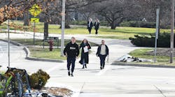 A group of students walking on the Michigan State University campus near the library on the first day of classes since the shooting on Feb. 20, 2023, in East Lansing, Michigan.