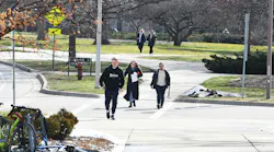 A group of students walking on the Michigan State University campus near the library on the first day of classes since the shooting on Feb. 20, 2023, in East Lansing, Michigan.