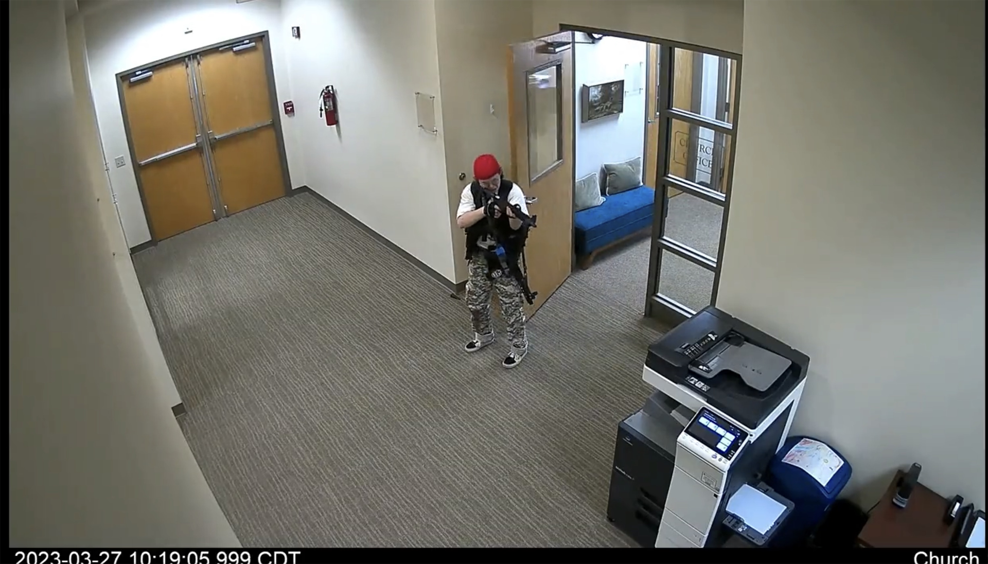 In this screen grab from surveillance video tweeted by the Metropolitan Nashville Police Department, Audrey Hale, 28, points an assault-style weapon inside The Covenant School in Nashville, Tennessee, Monday, March 27, 2023. (Metropolitan Nashville Police Department/TNS)