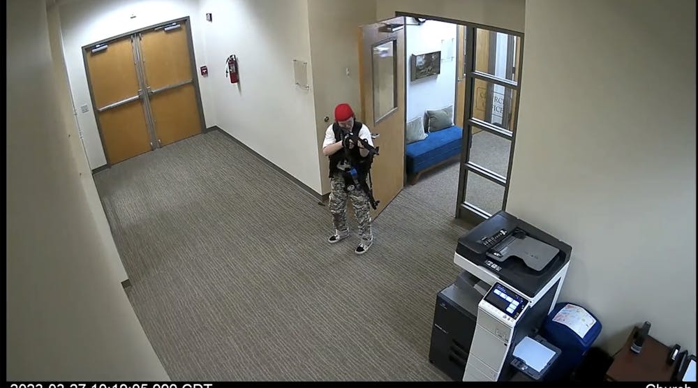 In this screen grab from surveillance video tweeted by the Metropolitan Nashville Police Department, Audrey Hale, 28, points an assault-style weapon inside The Covenant School in Nashville, Tennessee, Monday, March 27, 2023. (Metropolitan Nashville Police Department/TNS)