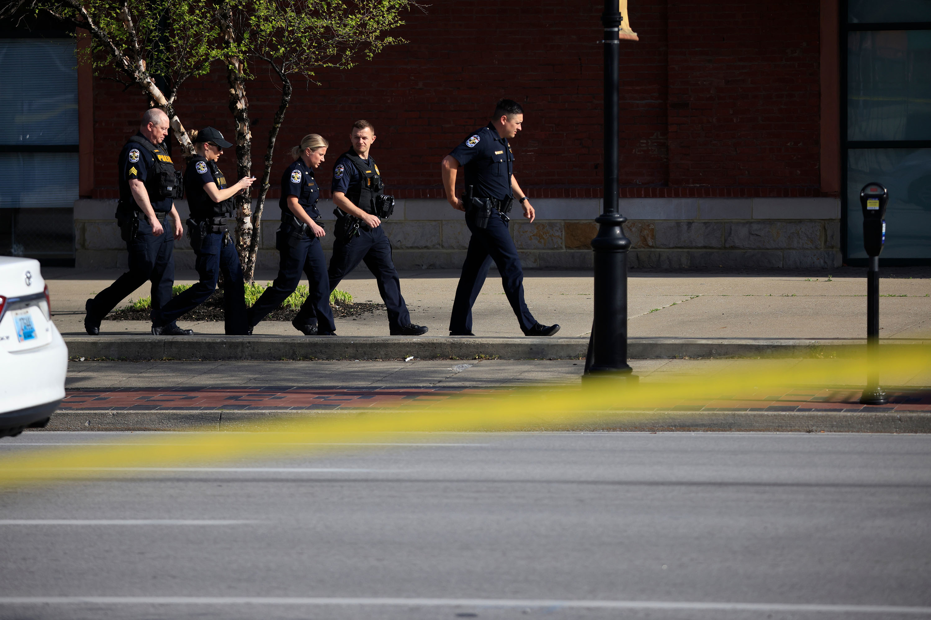 Law enforcement officers respond to an active shooter near the Old National Bank building on April 10, 2023, in Louisville, Ky. Five people are dead and at least six more have been hospitalized.