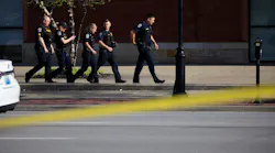 Law enforcement officers respond to an active shooter near the Old National Bank building on April 10, 2023, in Louisville, Ky. Five people are dead and at least six more have been hospitalized.