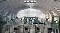 Security control machines and departures area at Bangkok Suvarnabhumi International Airport.