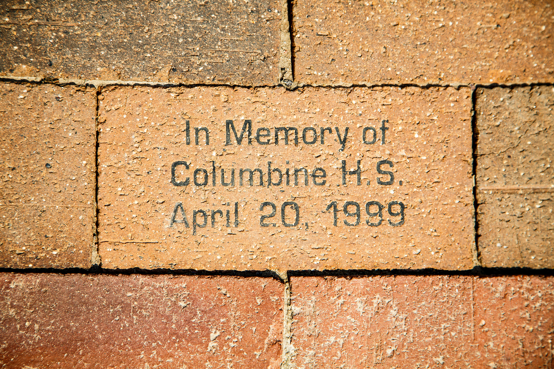A brick in a sidewalk in Denver in memory of the Columbine High School shooting in April 1999.