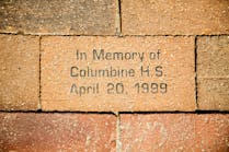 A brick in a sidewalk in Denver in memory of the Columbine High School shooting in April 1999.