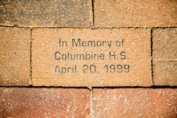 A brick in a sidewalk in Denver in memory of the Columbine High School shooting in April 1999. A brick in a sidewalk in Denver in memory of the Columbine High School shooting in April 1999.