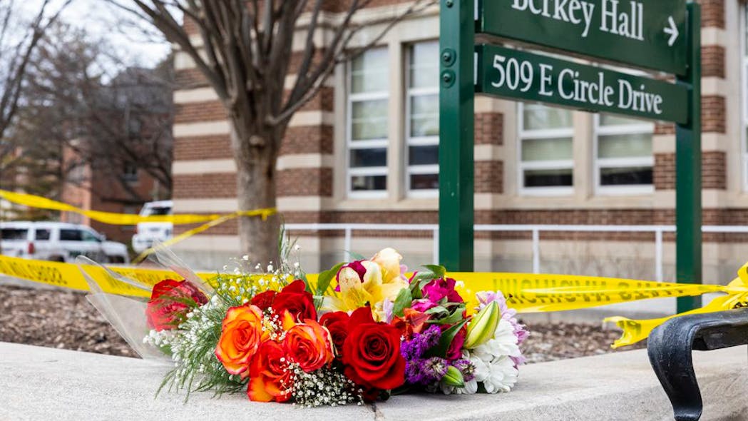 Flowers outside Berkey Hall following a mass shooting the evening before on the campus of Michigan State University in East Lansing, Michigan on Tuesday, Feb. 14, 2023.