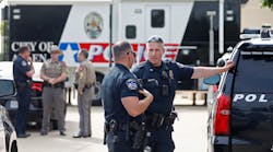 Law enforcement works the scene on the day after a shooting at Allen Premium Outlets on May 7, 2023, in Allen, Texas.
