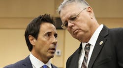 Former Marjory Stoneman Douglas High School School Resource Officer Scot Peterson, right, speaks with his defense lawyer Mark Eiglarsh following a hearing in 2022.