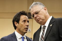Former Marjory Stoneman Douglas High School School Resource Officer Scot Peterson, right, speaks with his defense lawyer Mark Eiglarsh following a hearing in 2022. Former Marjory Stoneman Douglas High School School Resource Officer Scot Peterson, right, speaks with his defense lawyer Mark Eiglarsh following a hearing in 2022.