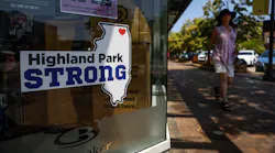 A person walks down Central Avenue on June 24, 2023, in Highland Park, just across from where last year's Fourth of July parade shooting took place.