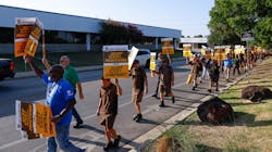 UPS employees practice pickets along Monroe Drive in Dallas on July 12, 2023. UPS employees are preparing to go on strike and have begun staging practice pickets across Texas for a union contract. UPS employees practice pickets along Monroe Drive in Dallas on July 12, 2023. UPS employees are preparing to go on strike and have begun staging practice pickets across Texas for a union contract.