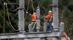 A crew works at an electrical substation in Washington state that was damaged by vandals early on Christmas morning, Dec. 25, 2022.