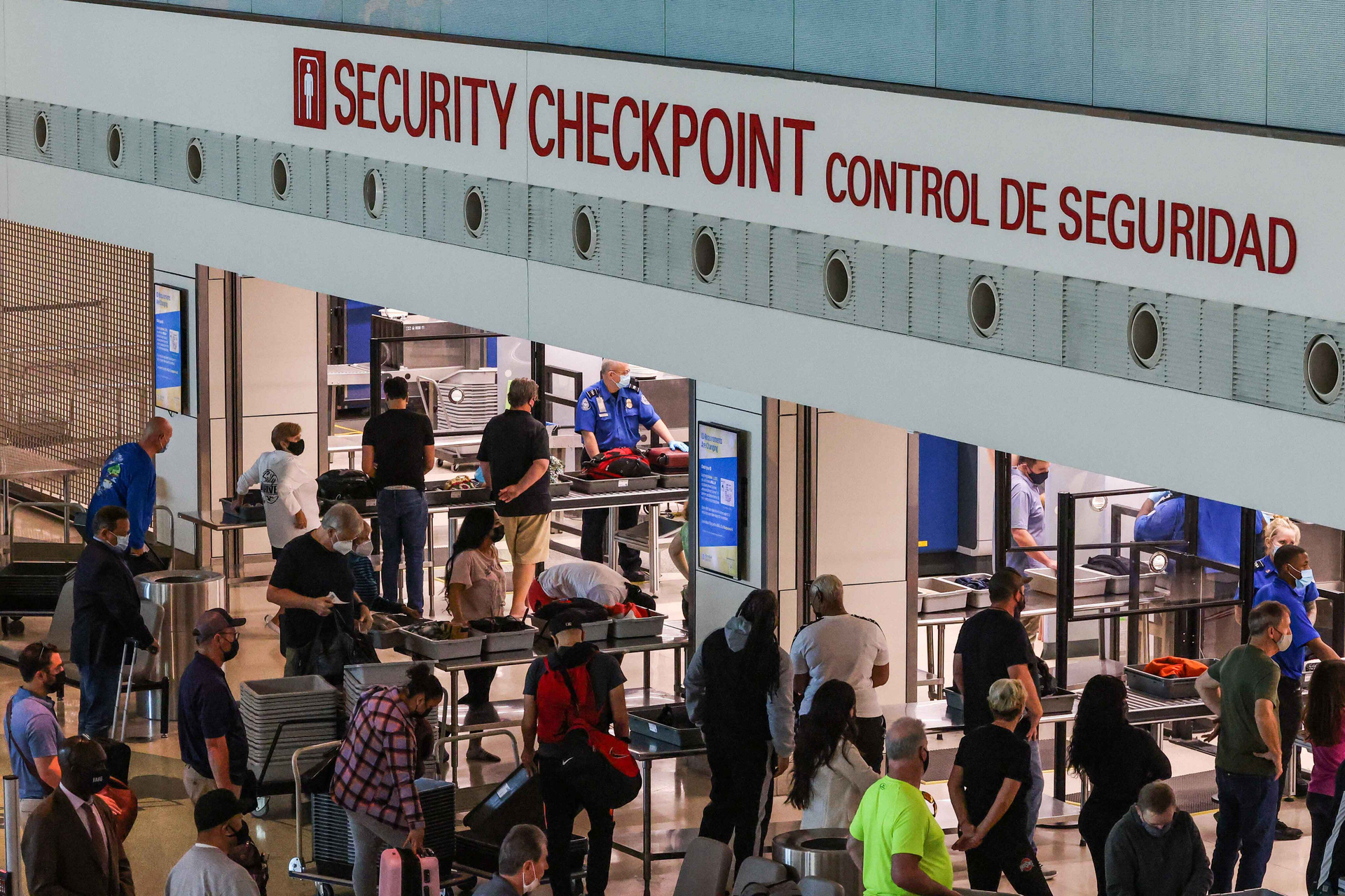 Travelers go through security checkpoint at the Dallas Love Field airport in Dallas. Biometric technology, such as facial recognition, is increasingly being used in TSA s identity verification process.